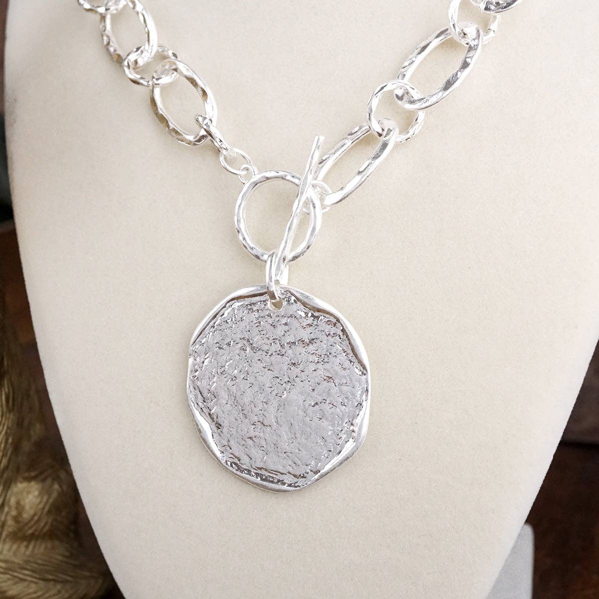 Nomad Glow – Front Toggle Statement Necklace with Hammered Disc